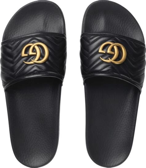 gold and black Gucci slides